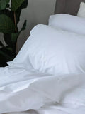 Parure de lit en percale de coton lavé avec un porcelet au lit